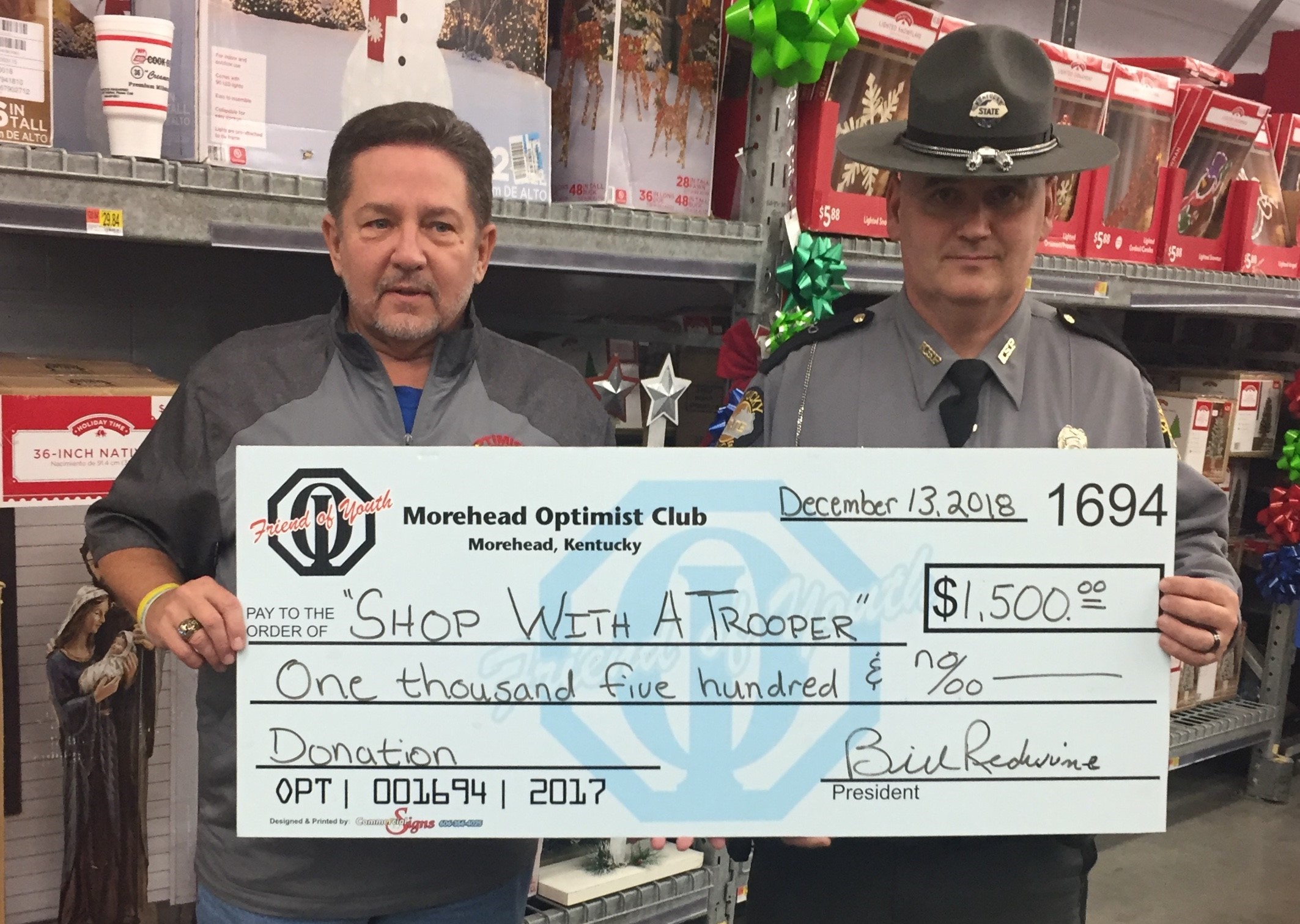 Presentation of check for "Shop With a Trooper"